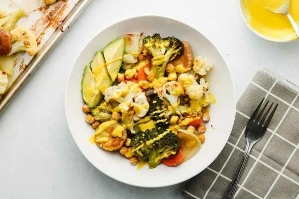 https://www.wellandgood.com/wp-content/uploads/2022/09/sheet-pan-roasted-vegetables-with-tumric-tahini-meal-prep-1-of-1-600x400_falsexfalse_true_70.webp