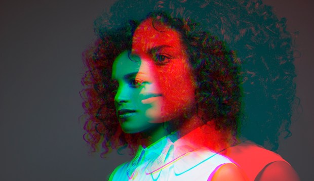 Multiple exposure side view of a dark empath woman in green and red