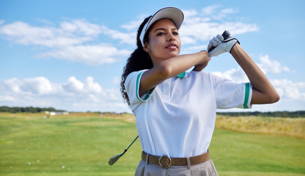 https://www.wellandgood.com/wp-content/uploads/2023/07/woman-playing-golf-wearing-a-golf-hat.jpg?w=1024