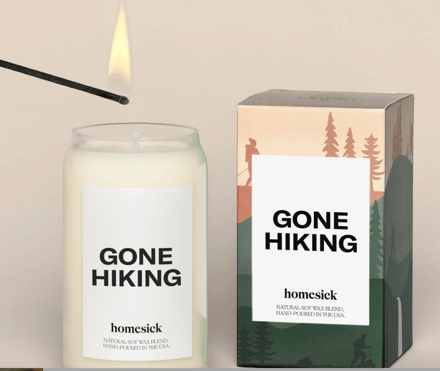 gone hiking candle on off-white background