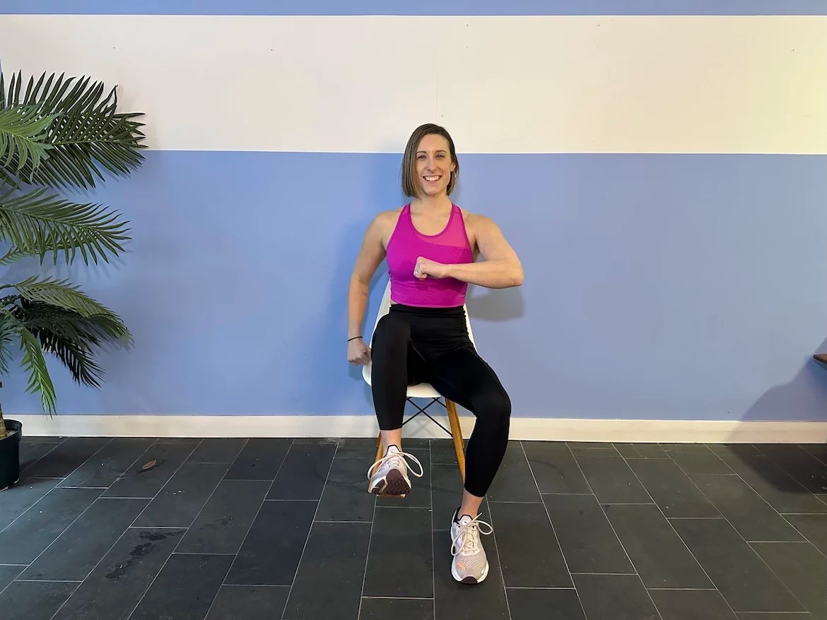Personal trainer demonstrating sitting and marching exercises
