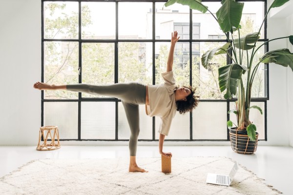 Been Feeling Weighed Down? Here's How To Reach for the Stars With Yoga’s Half Moon...