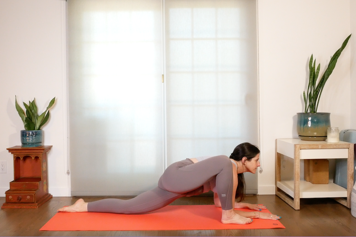 yoga instructor demonstrates how to do lizard pose correctly