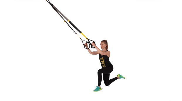 Person demonstrating TRX cross-balance lunge as part of TRX workout 