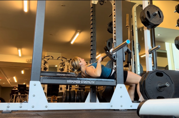 Personal trainer demonstrating low-bar row