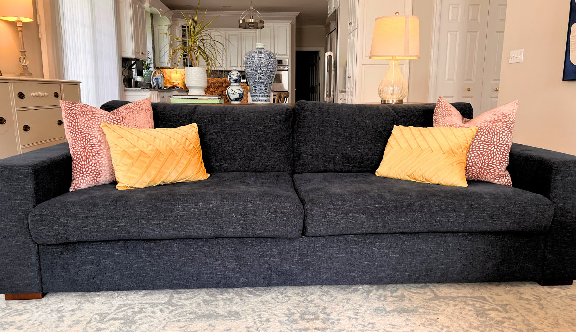 Image of a navy blue couch in a living room setting