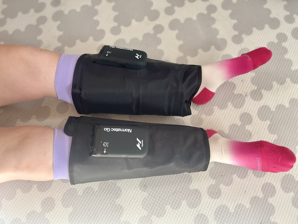 woman testing Normatec Go compression boots