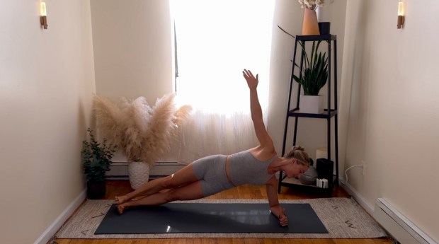 Personal trainer and Pilates instructor demonstrating side plank