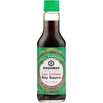 photo of a bottle of kikkoman low sodium soy sauce on a white background