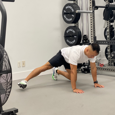 Physical therapist demonstrating quadruped hip liftoff