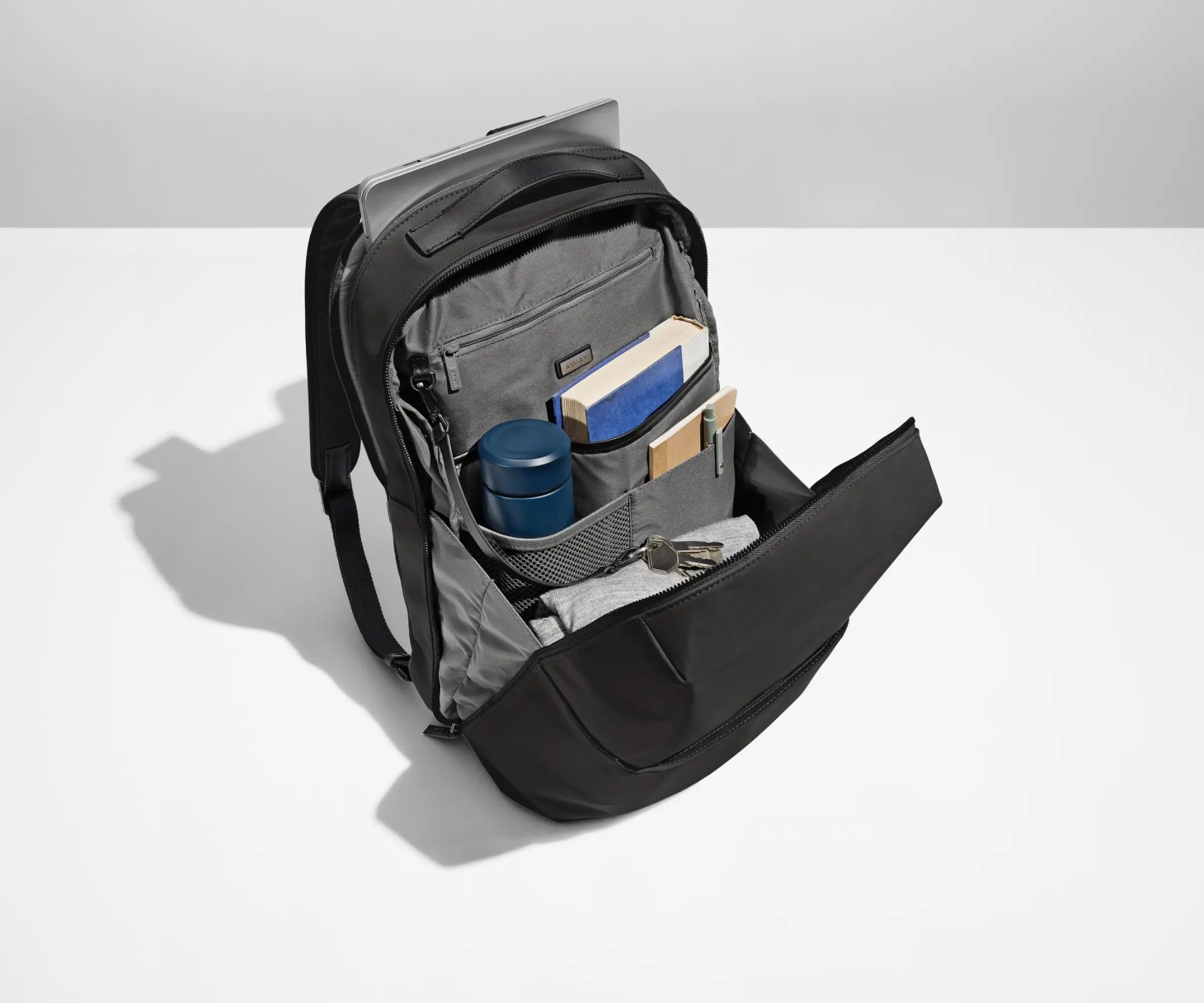 a black away everywhere zip backpack for college