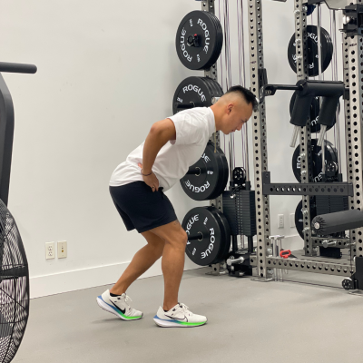 Physical therapist demonstrating kickstand deadlift