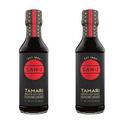 photo of two bottles of san-j tamari sauce on a white background