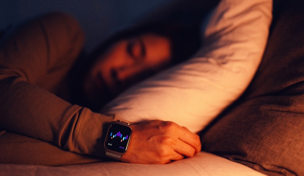 person sleeping with Apple Watch on