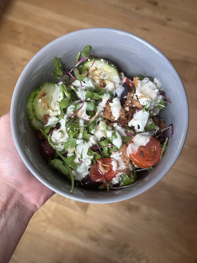 Photo of a salad dressed with SideDish Ranch 