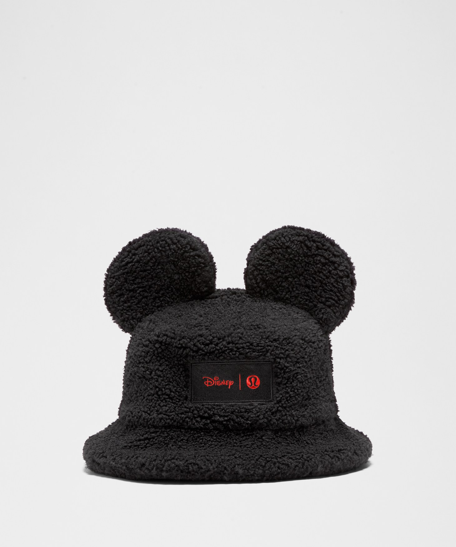 A black fleece bucket hat with mouse ears on top