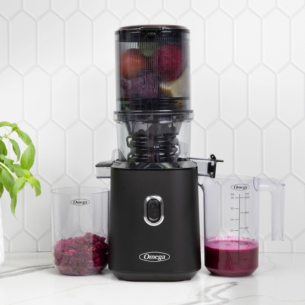 photo of the omega time saving cold press batch juicer atop a white counter