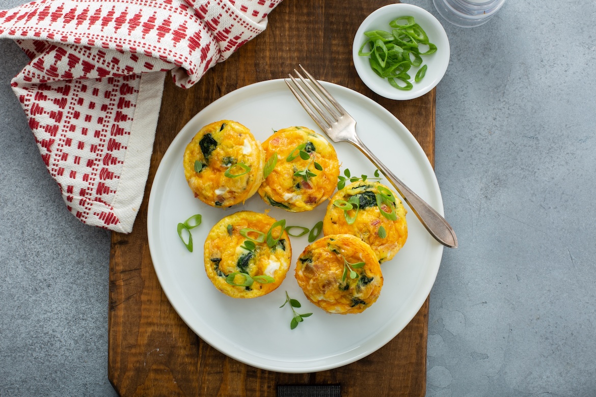 Sausage and spinach egg muffins as example of high-protein breakfast meal prep idea