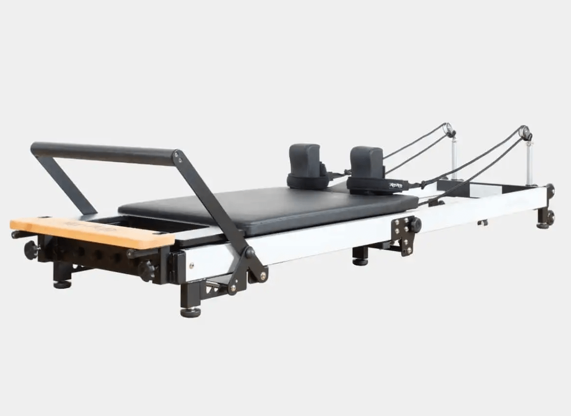 f3 folding pilates reformer on white background